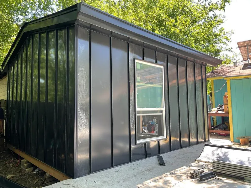 Black standing seam metal wall panels for Roof Inspection in Travis Ranch