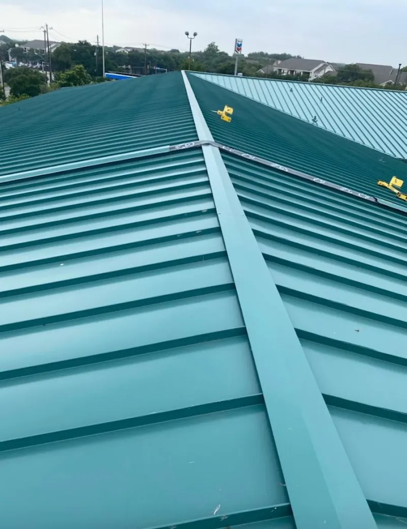 Green commercial metal roof ridge and valley for Metal Roof Repair in Travis Ranch